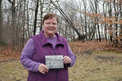 Dot Park Leader: Jane Boyer holds a photograph of her late mother, Jane Callahan Mullaney taken in Dorchester Park in the 1940s. It was taken near the present site of the tennis courts, where Boyer has organized annual Easter Egg hunts for children. Photo by Bill Forry
